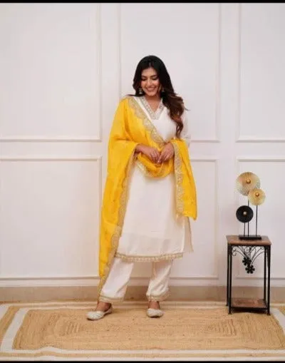 Ivory Heavy Muslin Silk Salwar Suit With Yellow Chiffon Dupatta