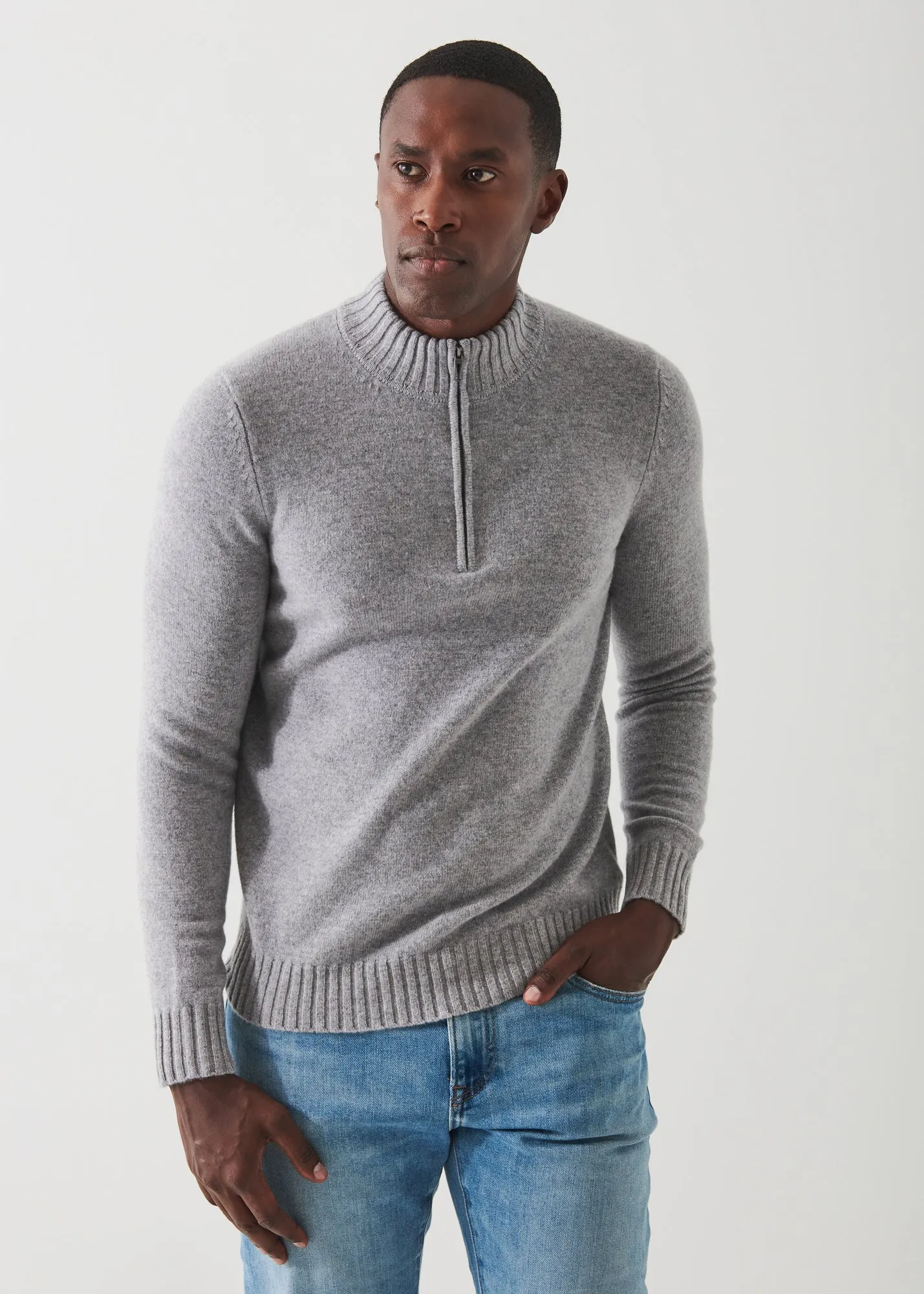 MERINO QUARTER ZIP SWEATER