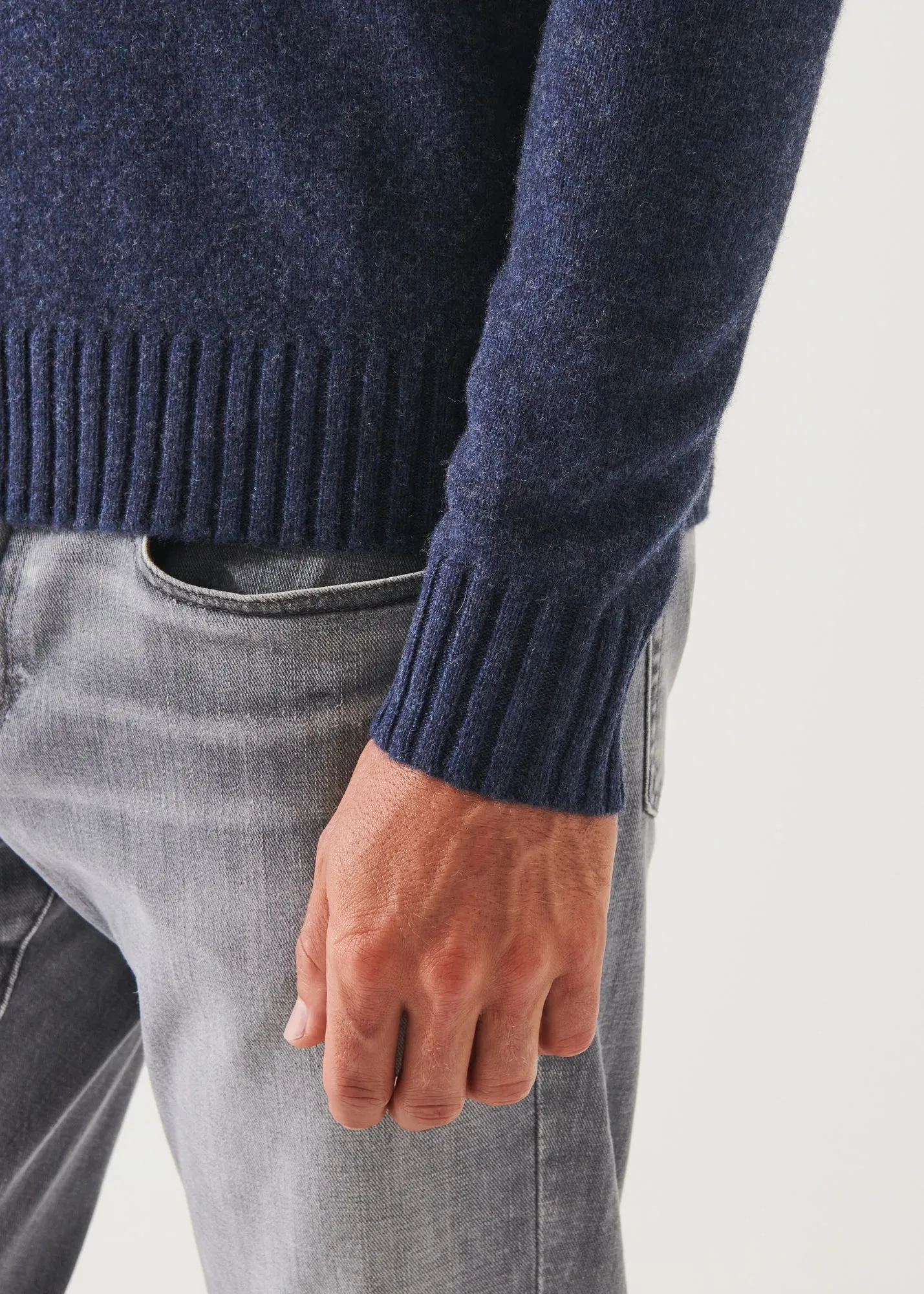 MERINO QUARTER ZIP SWEATER